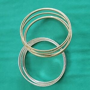 Set of 2 bangle bracelets, silver and gold